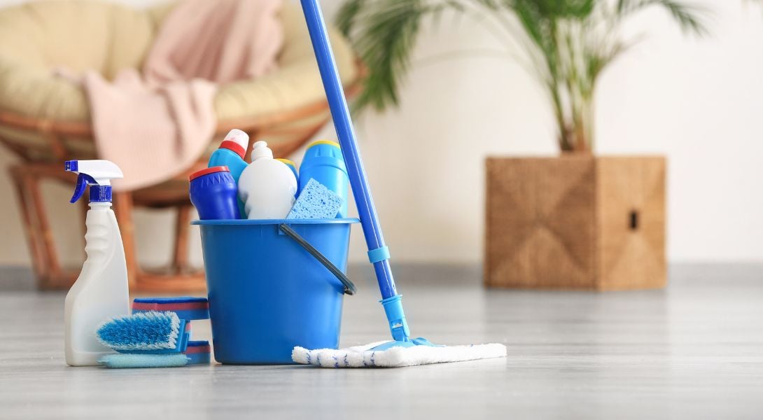 2 Set of Cleaning Supplies on Floor in a Room