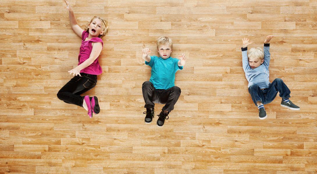5. Children lying on Vinyl wood floor