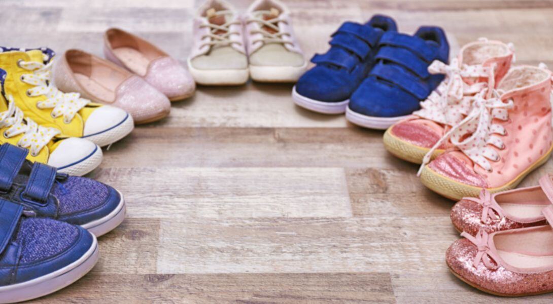 6. Colourful Kids Shoes on Wooden Floor