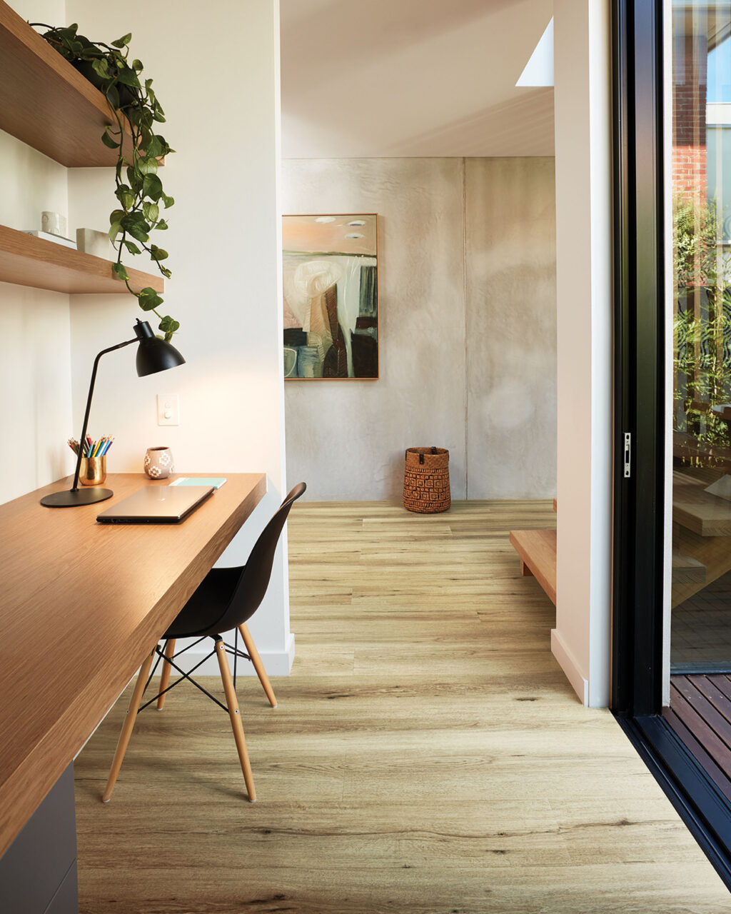 Open office space in home with hybrid flooring