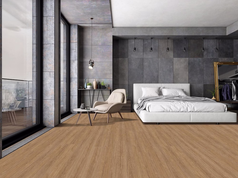 Bedroom with glass balcony doors and warm timber-look Tarkett iD Comfort 19 vinyl in Classic Oak Brown